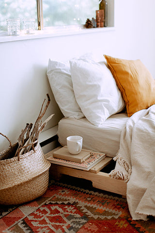 bed dressed in a clean white sheet, including a free pillow sham